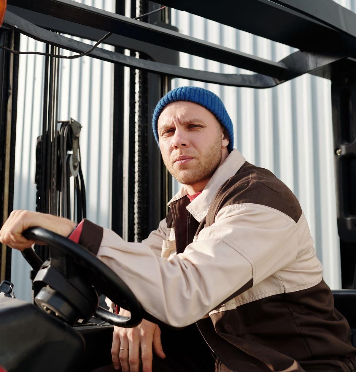 Self-employed driver delivering large appliance